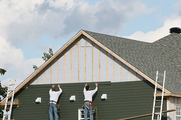 Professional Storm Damage Siding Repair technician working in Reston, VA